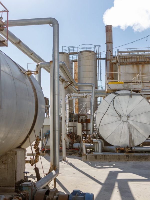 Shot of manufacturing site of modern concrete batching plant with clear blue sky